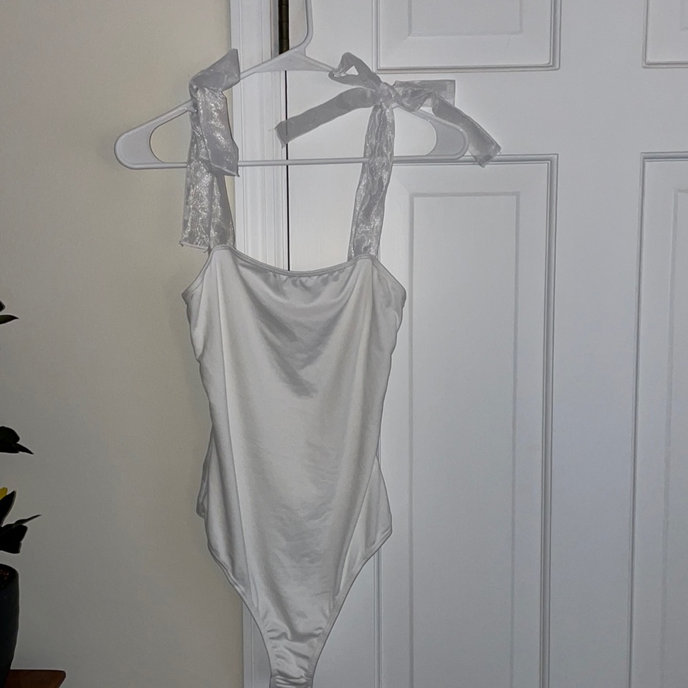 White one piece with bows